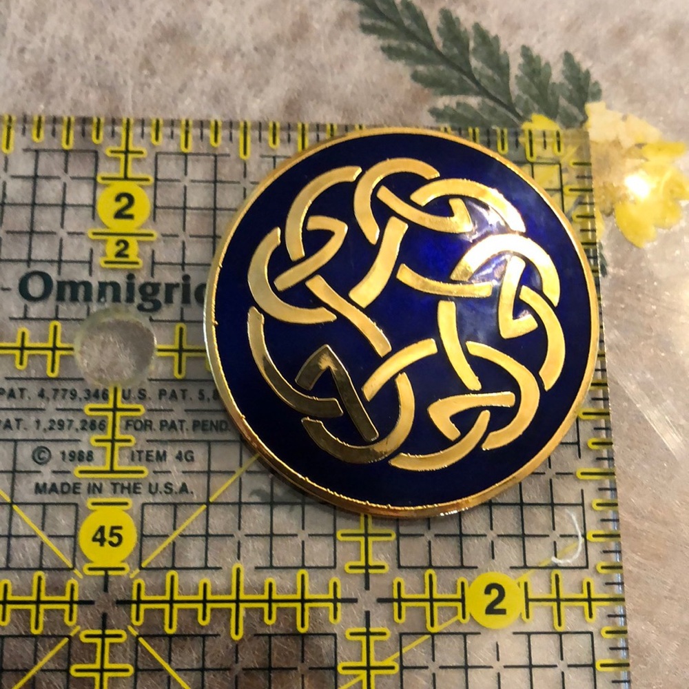 Celtic brooch in blue enamel and gold